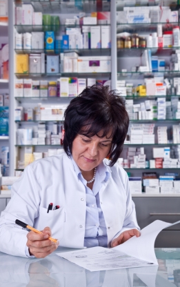 Pharmacist providing prescribed medicines and medication guidance at Doctor Gowri's Balaji Hospital, Tirupati.