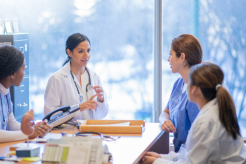 Doctor consulting with patients at Doctor Gowri's Balaji Hospital, offering expert medical care in Tirupati.